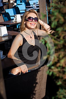 Beautiful blond girl in a cafe