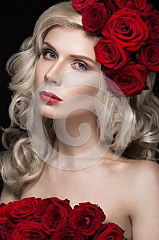 Beautiful blond girl in dress and hat with roses, classic makeup, curls, red lips. Beauty face.