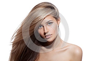 Beautiful Blond Girl. Healthy Long Hair. White Background