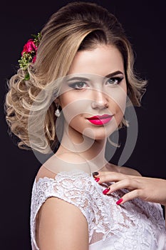 Beautiful blond girl in image of the bride with purple flowers on her head. Beauty face