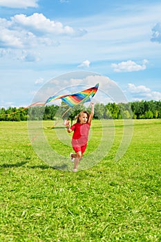Beautiful blond girl with kite
