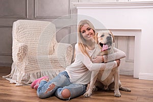 Beautiful blond girl with Labrador Retriever