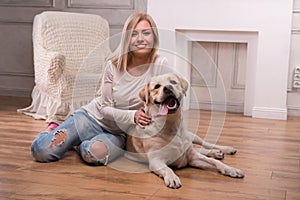 Beautiful blond girl with Labrador Retriever