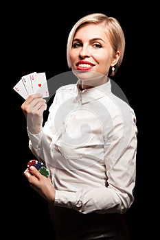 Beautiful blond girl showing a poker cards