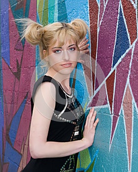 Beautiful blond girl and wall mural