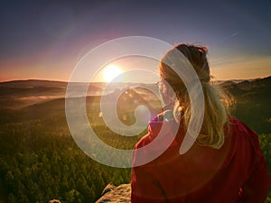 Beautiful blond hair woman looking outside