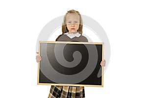 Beautiful blond schoolgirl sad moody and tired holding and showing small blank blackboard