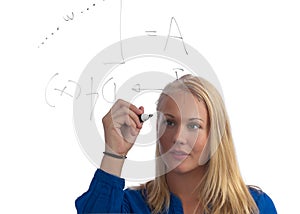 Beautiful blond student solving a math problem