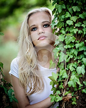 Beautiful Blond Teenage Girl Outside In The Woods