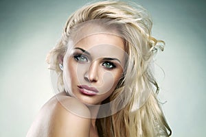 Beautiful Blond woman. amazing curly girl with make-up