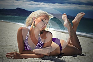 Beautiful blond woman on the beach. beauty girl in bikini. summer holidays