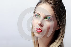 Beautiful blond woman with colorful make up