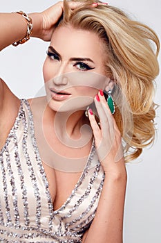 Beautiful blond woman dress luxary party jewelry makeup