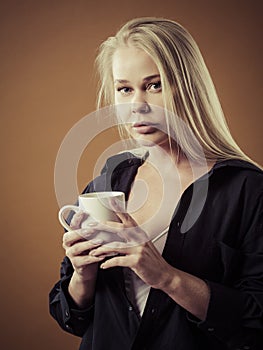 Beautiful blond woman drinking coffee