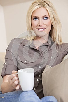 Beautiful Blond Woman Drinking Tea or Coffee