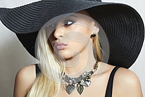 Beautiful Blond Woman in Hat. Spring. Jewelry