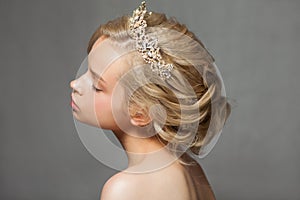 Beautiful blond woman in the image of a bride with a tiara in her hair