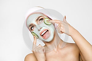 Beautiful blond woman with moisturized face mask. Beauty spa