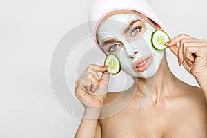 Beautiful blond woman with moisturized face mask. Beauty spa