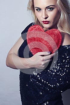 Beautiful Blond Woman with Red Heart. Beauty Girl. Show Love Symbol. Valentine's Day.Passion