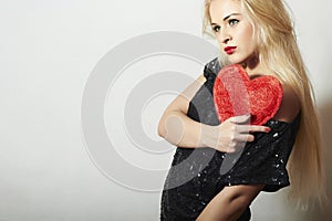 Beautiful Blond Woman with Red Heart. Beauty Girl. Show Love Symbol. Valentine's Day.Passion