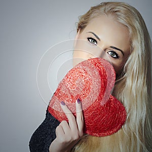 Beautiful Blond Woman with Red Heart. Beauty Girl. Show Love Symbol. Valentines Day