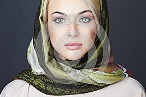 Beautiful blond woman in scarf.winter fashion.Beauty Girl.Classic Russian style.close-up make-up