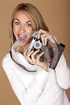 Beautiful blond woman taking photographs.