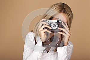 Beautiful blond woman taking photographs.