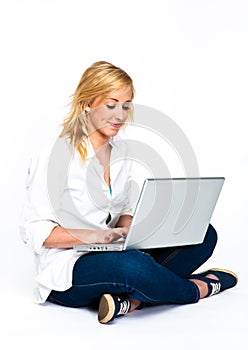 Beautiful Blond Woman typing on laptop