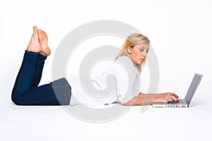 Beautiful Blond Woman typing on Laptop