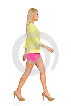 Beautiful Blond Woman Is Walking In High Heels Side View