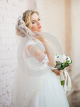 Beautiful blonde bride with stylish make-up