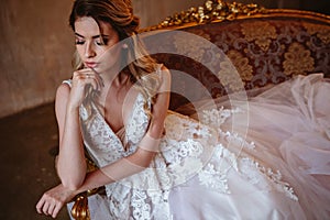 Beautiful blonde bride woman in a gorgeous wedding dress, fashion beauty portrait