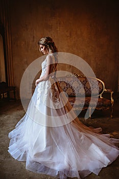 Beautiful blonde bride woman in a gorgeous wedding dress, fashion beauty portrait
