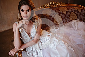 Beautiful blonde bride woman in a gorgeous wedding dress, fashion beauty portrait