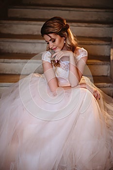 Beautiful blonde bride woman in a gorgeous wedding dress, fashion beauty portrait