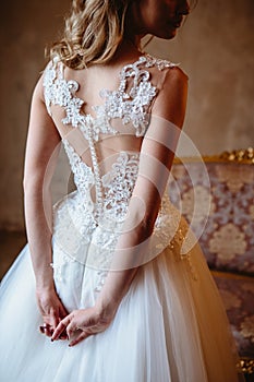 Beautiful blonde bride woman in a gorgeous wedding dress, fashion beauty portrait