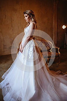Beautiful blonde bride woman in a gorgeous wedding dress, fashion beauty portrait