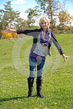 Beautiful Blonde Country Girl with Arms out Facing Camera