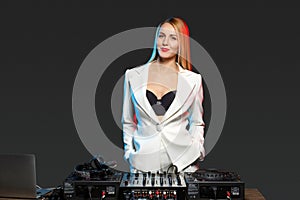 Beautiful blonde DJ girl on decks - the party