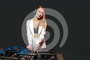 Beautiful blonde DJ girl on decks - the party