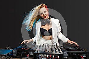 Beautiful blonde DJ girl on decks - the party