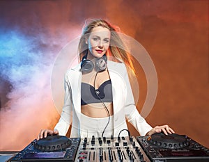 Beautiful blonde DJ girl on decks - the party