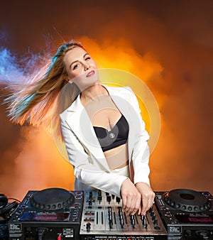 Beautiful blonde DJ girl on decks - the party