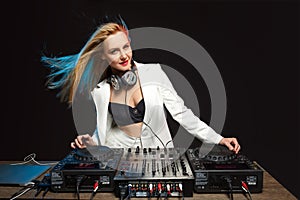 Beautiful blonde DJ girl on decks - the party