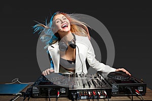 Beautiful blonde DJ girl on decks - the party