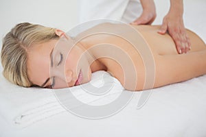 Beautiful blonde enjoying a massage