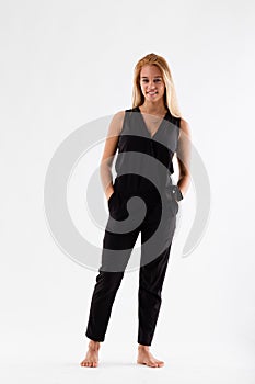 Beautiful, blonde, in fashion black jumpsuit