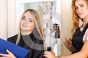 Beautiful blonde female hairdresser